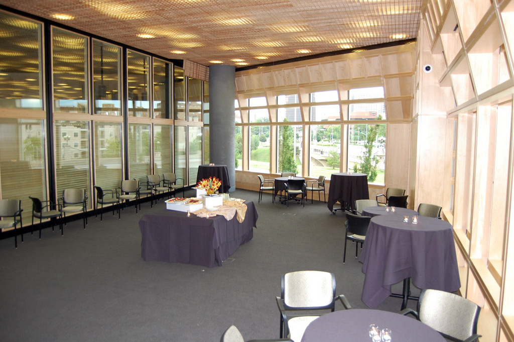 tables in windowed room with tablecloths